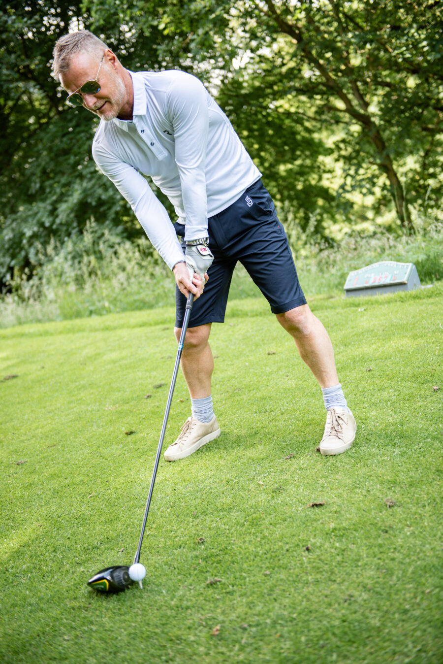 Navy Blue shorts with white Redi logo and long sleeved white breathable top