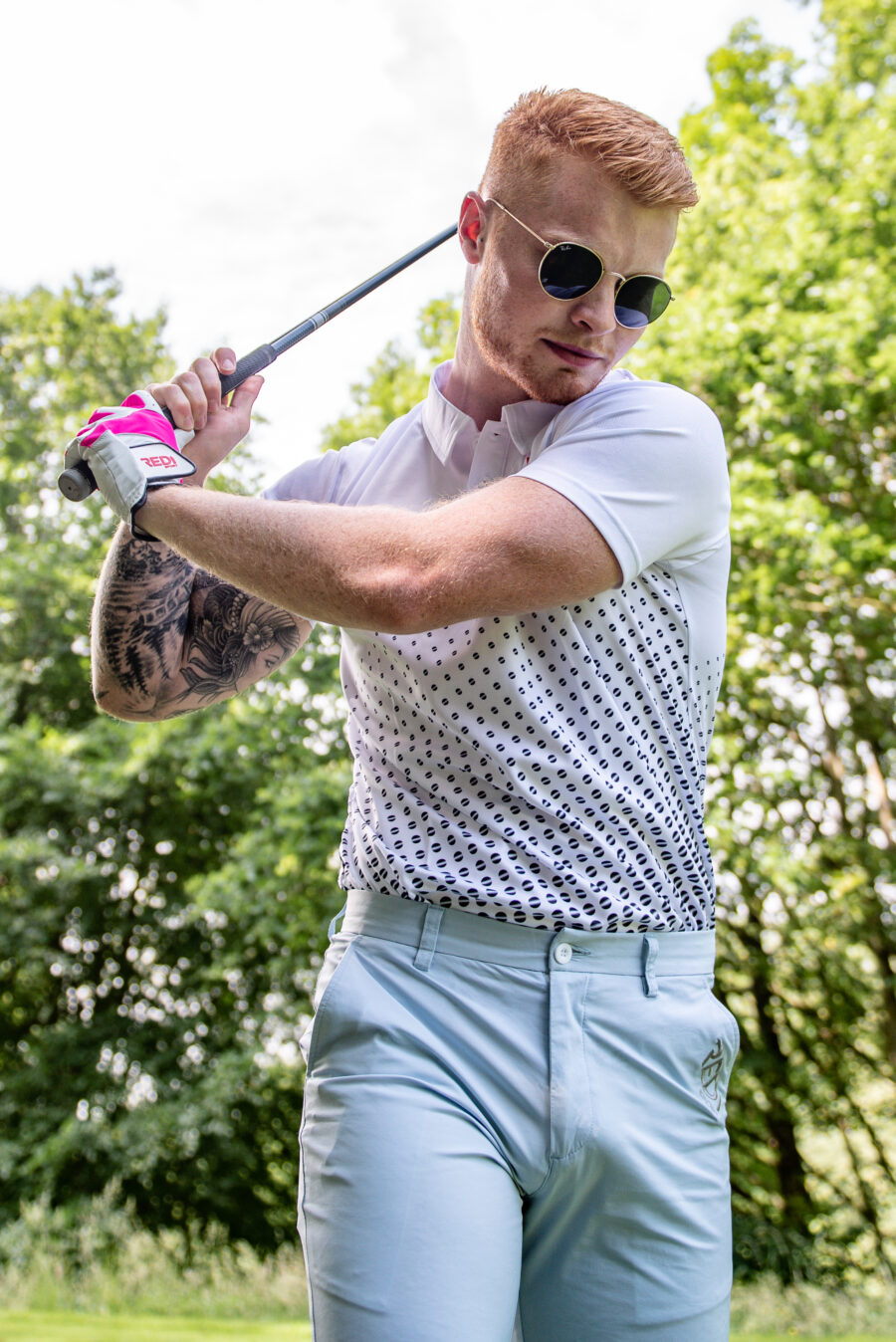 white polo with black dots breathable material